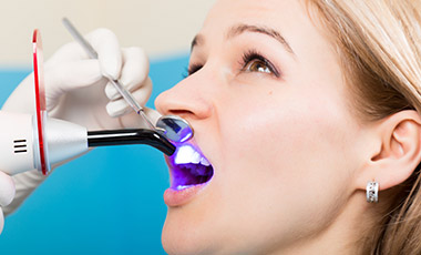 Woman receiving dental bonding treatment