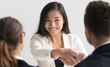 young attractive woman shaking hands