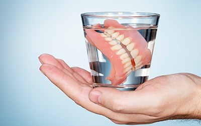 Dentures in glass of water