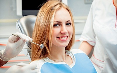 Smiling woman in dental chair