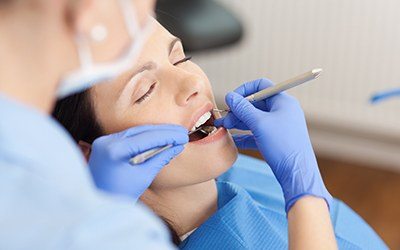 Woman receiving dental exam