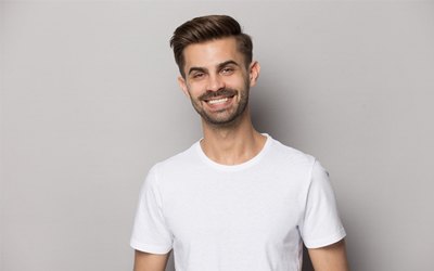 A young man smiling